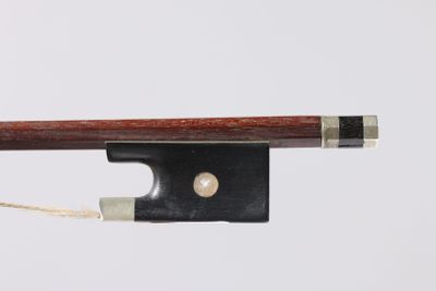 a violin bow with a piece of string attached to it