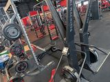a gym with a lot of equipment in the room