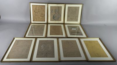 several framed and unframed art pieces of art on a table