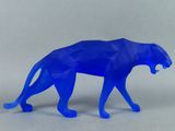 a blue plastic figure of a panther on a white background