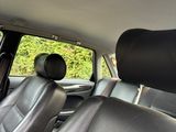 a view of the back seats of a car from the driver ' s seat