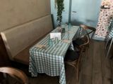 a table with a blue and white checkered table cloth on it