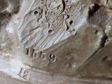 a close up of a statue of a man with a hat on