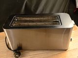 a toaster that is sitting on a wooden table