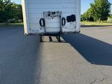 an image of a white truck parked in a parking lot