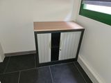 a small cabinet in the corner of a room