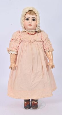 an old doll with a bonnet and dress on a white background