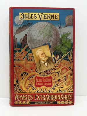 un vieux livre sur lequel figure l'image d'un homme tenant un globe terrestre