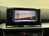 a picture of a car ' s dashboard with a camera mounted on it
