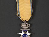a close up of a medal on a black surface