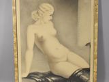 an old picture of a nude woman sitting on a bed