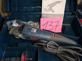 a blue tool box with a corded cord and a tool in it