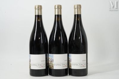 three bottles of wine sitting on top of a white table