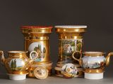 four different types of teapots and cups on a table