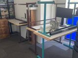 a desk with a computer on it in a room