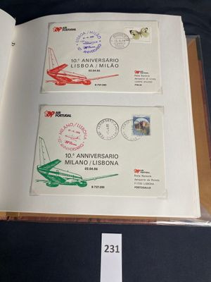 an open book with stamps and stamps on it sitting on a table