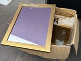 a cardboard box with a picture in it sitting on the floor