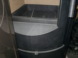 an image of a black trash can and a black trash can