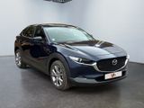 the mazda cx - hr suv is parked in a showroom