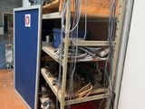 a room with a bunch of wires on the shelves