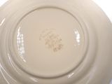 a white plate with a brown design on it