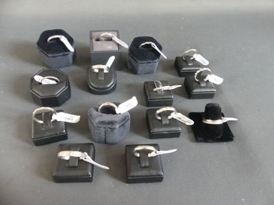 a lot of different rings and bracelets that are on the table