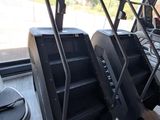 a row of treads in a gym room with a view of the outside