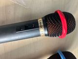 two microphones that are sitting on a table
