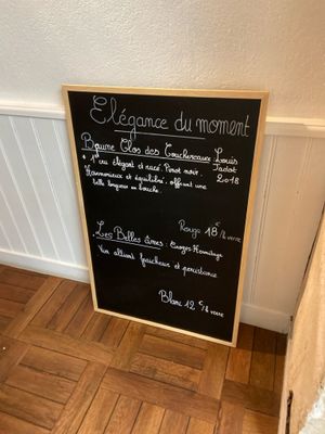 a chalk board with a menu on it in a room