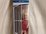 an image of a woman standing in front of a screen door