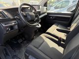 the interior of a car with a steering wheel and dashboard controls