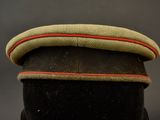 a close up of a military hat on a mannequin head