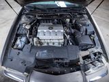 a car with its hood open and the engine in the back