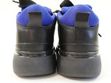 a close up of a pair of black and blue shoes