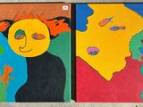 painting of a couple of people with faces painted on a wall
