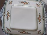 a square plate with a square plate on top of it