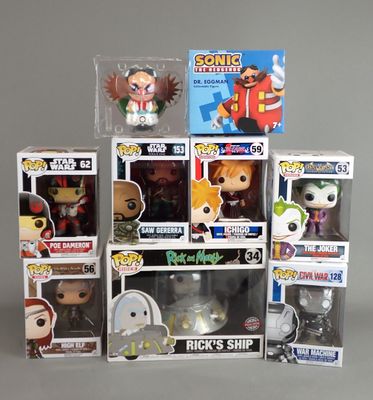 a bunch of pop vinyl figures in a display case
