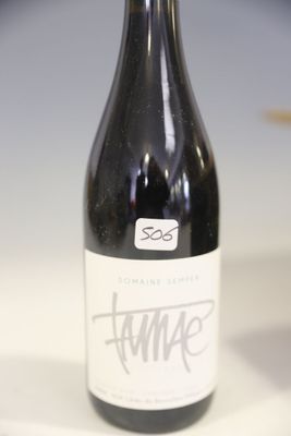 a bottle of wine that is sitting on a table