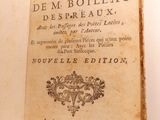 an old book opened to show the title of the book