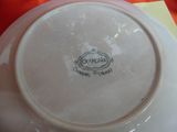 a close up of a plate with a name on it
