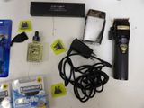 the contents of a man ' s shaver, razor, razor, razor blade, and other items laid out on a table
