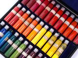 many different colors of paint in a black box