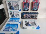 four boxes of legos sitting on a table