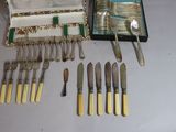 a lot of silverware in a case on a table