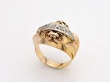 a close up of a gold ring with diamonds on a white background