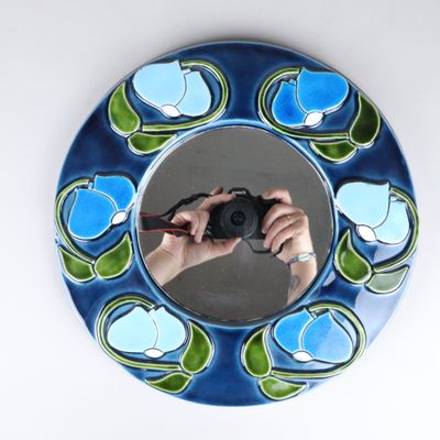 a person taking a picture of themselves in a mirror