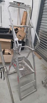 a ladder that is leaning against a wall in a garage