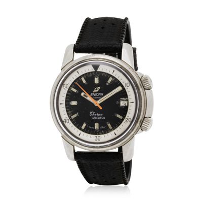 a close up of a watch on a white background with a black strap