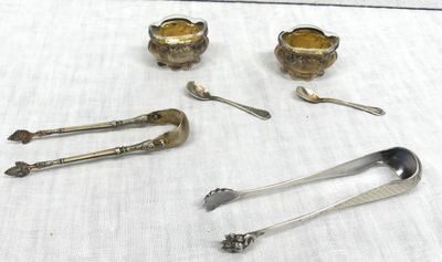 a lot of silver spoons and spoons on a table