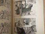an open book with pictures of people on it